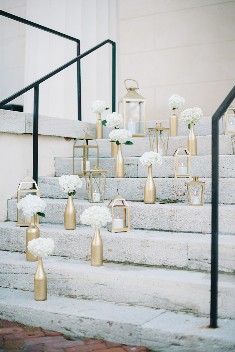 Gold Candle and Floral Display on Reception Venue Steps