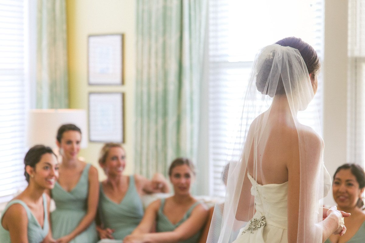 _Bride's veil and bridesmaids looking at brideTAWed0146