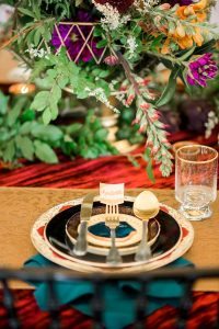 colorful wedding reception place setting emerald gold fuschia orange yellow