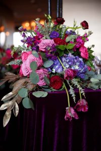 colorful floral centerpiece pink purple red gold