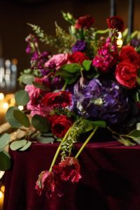 red purple pink floral arrangements wedding