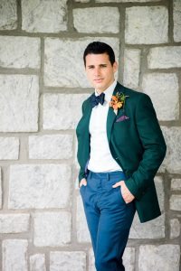 groom fashion emerald tuxedo jacket orange yellow purple boutonniere