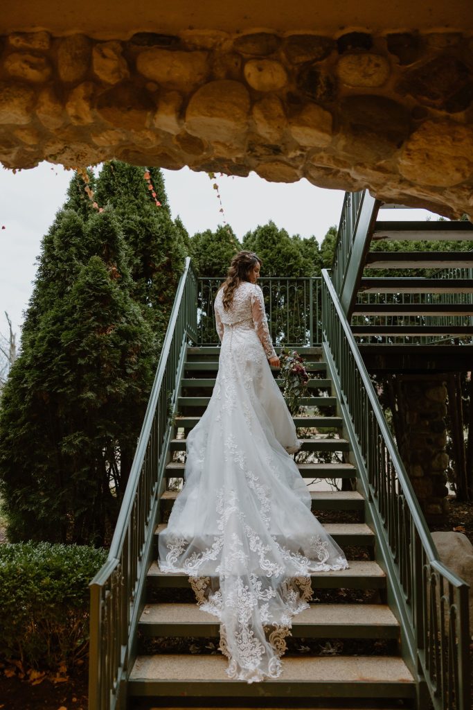 bride on stairs at Boulder Ridge Country Club