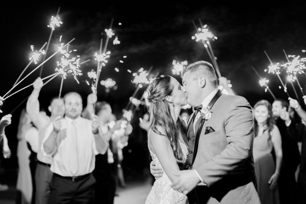 couple kissing with sparklers
