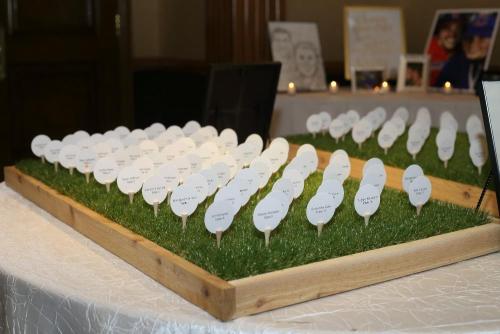 Playing up their country club venue, Delaney & Ross opted "fore" a golf-themed seating chart. 